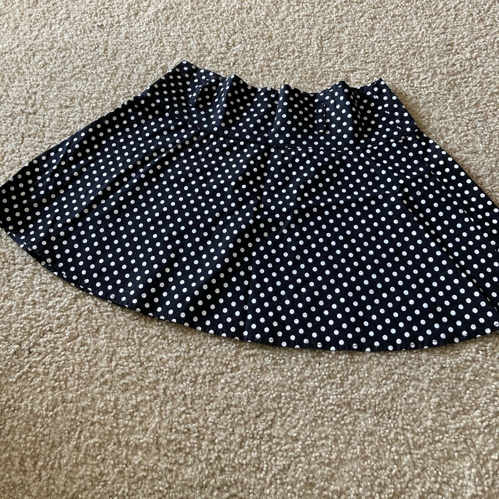 Black polka dot mini skirt